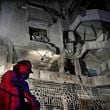 A firefighter stands in front of an apartment hit by an Israeli airstrike, in Beirut, Lebanon, Thursday, Oct. 3, 2024. (AP Photo/Hussein Malla)