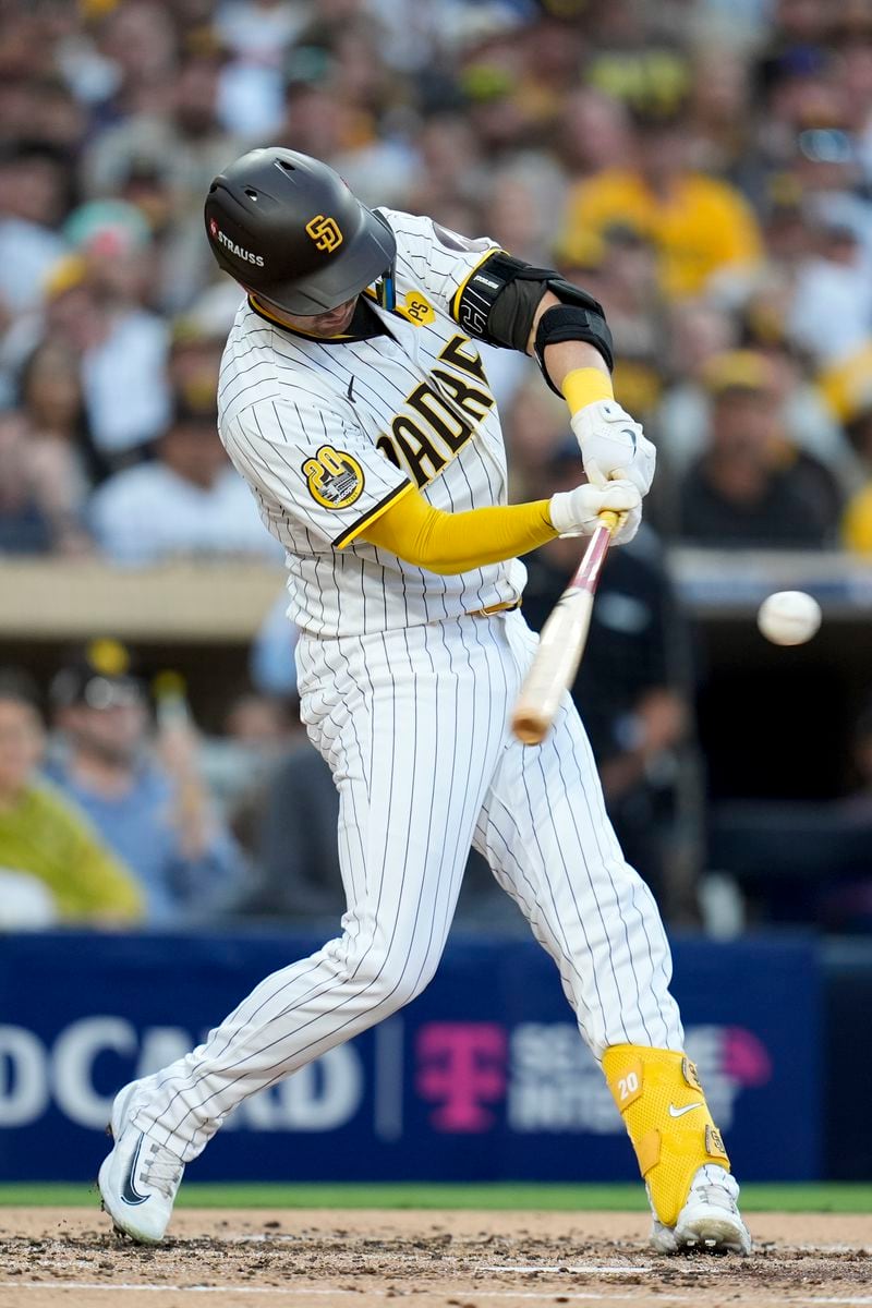 San Diego Padres' Kyle Higashioka connects for a solo home run during the second inning in Game 2 of an NL Wild Card Series baseball game against the Atlanta Braves, Wednesday, Oct. 2, 2024, in San Diego. (AP Photo/Gregory Bull)