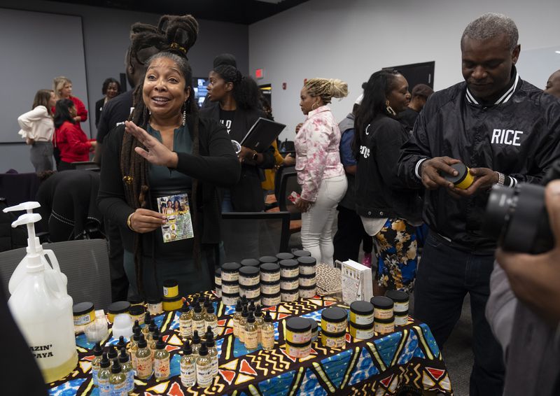 L’Angela Lee, owner and CEO of Honeysuckle Moon, talks about some of her products during an event at the Russell Innovation Center for Entrepreneurs in Atlanta on Tuesday, Nov. 21, 2023. Photo by Ben Gray ben@bengray.com