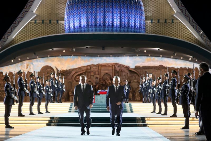 Russian President Vladimir Putin, left, and Uzbek President Shavkat Mirziyoyev visit Yangi O'zbekiston park during their meeting in Tashkent, Uzbekistan, Sunday, May 26, 2024. (Mikhail Metzel, Sputnik, Kremlin Pool Photo via AP)