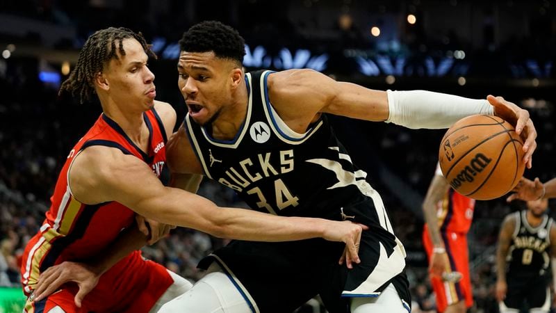 Milwaukee Bucks' Giannis Antetokounmpo (34) drives to the basket against New Orleans Pelicans' Dyson Daniels during the first half of an NBA basketball game Saturday, Jan. 27, 2024, in Milwaukee. (AP Photo/Aaron Gash)