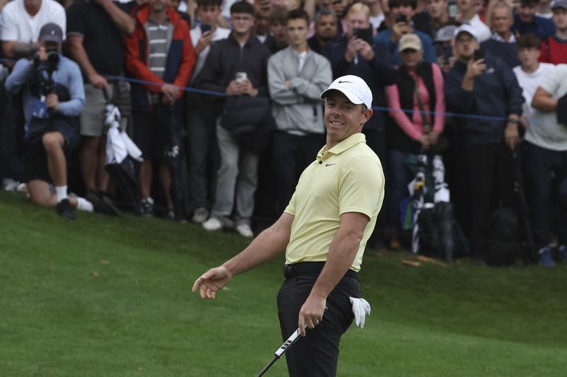 Rory McIlroy, of Northern Ireland, races after putting on the 18th green during a play off for the British PGA golf Championship, with Billy Horschel of the United States winning the playoff, at Wentworth golf club in Wentworth, England, Sunday, Sept. 22, 2024. (AP Photo/Ian Walton)