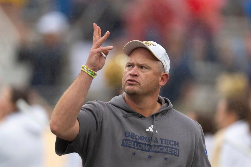 Georgia Tech head coach Brent Key waves to fans as he enters the field for the start of a NCAA college football game against Virginia Military Institute Saturday, Sept. 14, 2024, in Atlanta,. (AP Photo/John Bazemore)