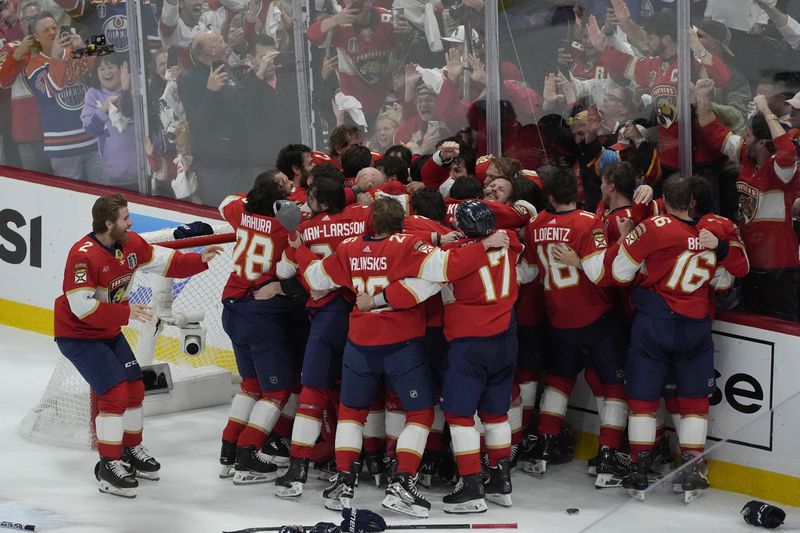 Florida Panthers players celebrate after defeating the Edmonton Oilers in Game 7 of the NHL hockey Stanley Cup Final, Monday, June 24, 2024, in Sunrise, Fla. The Panthers defeated the Oilers 2-1. (AP Photo/Rebecca Blackwell)