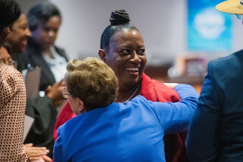 Interim Atlanta Public Schools Superintendent Danielle Battle hugs board member Cynthia Briscoe Brown during a swearing-in ceremony for the new superintendent, Bryan Johnson, in Atlanta on Monday, Aug. 5, 2024.  (Ziyu Julian Zhu / AJC)