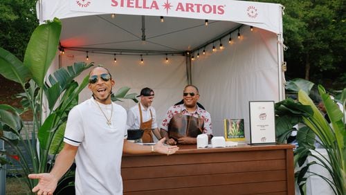 Christopher "Ludacris" Bridges poses in front of his Chicken and Beer restaurant stand at the Luda's Cookout event on August 14, 2024, in Atlanta's Piedmont Park.