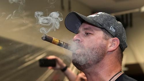 Cleveland Guardians manager Stephen Vogt celebrates winning the American League Central with his team in the clubhouse following a baseball game against the St. Louis Cardinals Saturday, Sept. 21, 2024, in St. Louis. (AP Photo/Jeff Roberson)