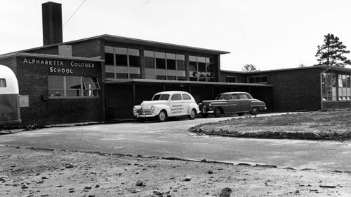 Pictured is a car parked outside the Alpharetta Colored School, a segregated school for African Americans in Alpharetta, in 1952.(Kathleen Moon / Courtesy of Kenan Research Center at Atlanta History Center)