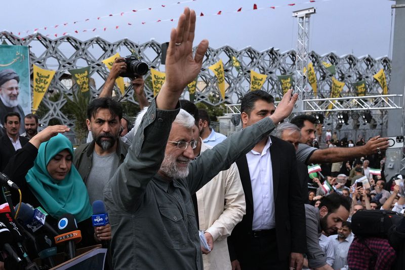 Candidate for the June 28, presidential election, Saeed Jalili, a former Iran's top nuclear negotiator, waves to his supporters during a campaign rally in Tehran, Iran, Monday, June 24, 2024. (AP Photo/Vahid Salemi)