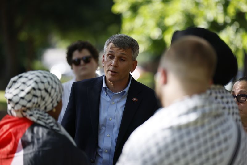 Eric Atkinson, University of Georgia dean of students, answer questions from International Affairs student Zeena Mohamed during a rally UGA Old Campus lawn in Athens following arrests on Monday, April 29, 2024. Mohamed was one of the students arrested on Monday morning and later released to find out she has been suspended from the school.
(Miguel Martinez / AJC)
