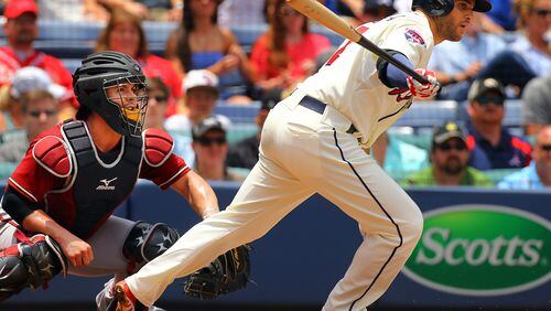 Braves Tommy La Stella bats against the Diamondbacks during the second inning when he singled with Tuffy Gosewisch looking on in their MLB game on Sunday, July 6, 2014, in Atlanta. CURTIS COMPTON / CCOMPTON@AJC.COM