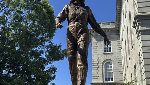 A statue of America's first teacher in space, Christa McAuliffe, who died when the space shuttle Challenger broke apart in 1986, is seen after its unveiling on what would've been her 76th birthday, Monday, Sept. 2, 2024, in Concord, N.H. (AP Photo/Nick Perry)