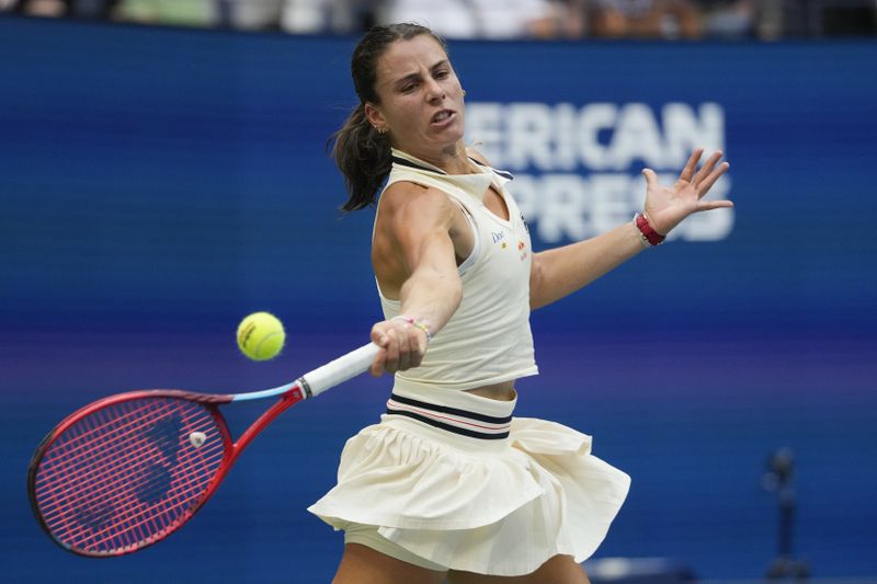 Emma Navarro, of the United States, returns a shot to Coco Gauff, of the United States, during the fourth round of the U.S. Open tennis championships, Sunday, Sept. 1, in New York. 2024. (AP Photo/Pamela Smith)