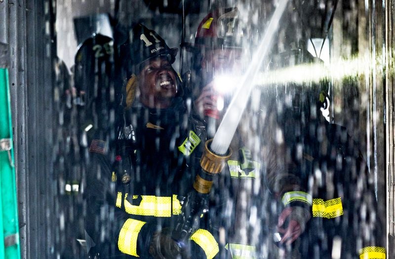 Atlanta firefighters work at a Midtown McDonald's.