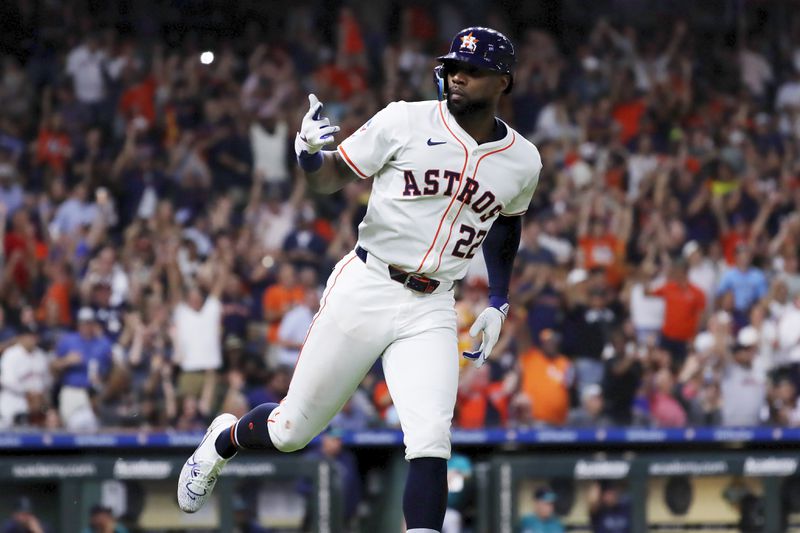 Houston Astros' Jason Heyward gestures to the dugout as he rounds the bases on his two-run home run against the Seattle Mariners during the fifth inning of a baseball game Tuesday, Sept. 24, 2024, in Houston. (AP Photo/Michael Wyke)