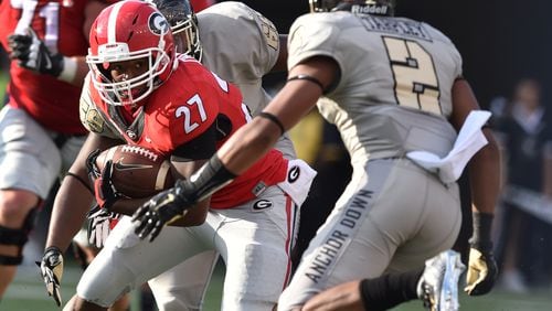 September 12, 2015 Nashville, TN : Georgia Bulldogs running back Nick Chubb looks for a way around Vanderbilt Commodores safety Arnold Tarpley during the second half in Nashville Saturday September 12, 2015. BRANT SANDERLIN /BSANDERLIN@AJC.COM