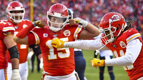 Kansas City Chiefs quarterback Patrick Mahomes celebrates his 27-yard touchdown run late in the second quarter against the Tennessee Titans during the AFC championship game on Sunday, Jan. 19, 2020, at Arrowhead Stadium in Kansas City, Mo.