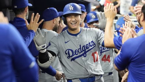 Los Angeles Dodgers' Shohei Ohtani (17) celebrates after hitting a home run during the sixth inning of a baseball game against the Miami Marlins, Thursday, Sept. 19, 2024, in Miami. (AP Photo/Marta Lavandier)