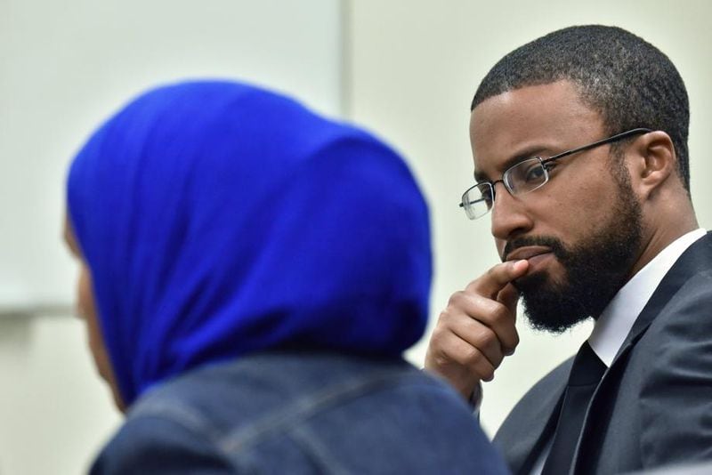 Aisha Hussein, the sister of Shukri Ali Said, talks about her sister’s death in July 2018 as Edward Mitchell of CAIR Georgia looks on.
