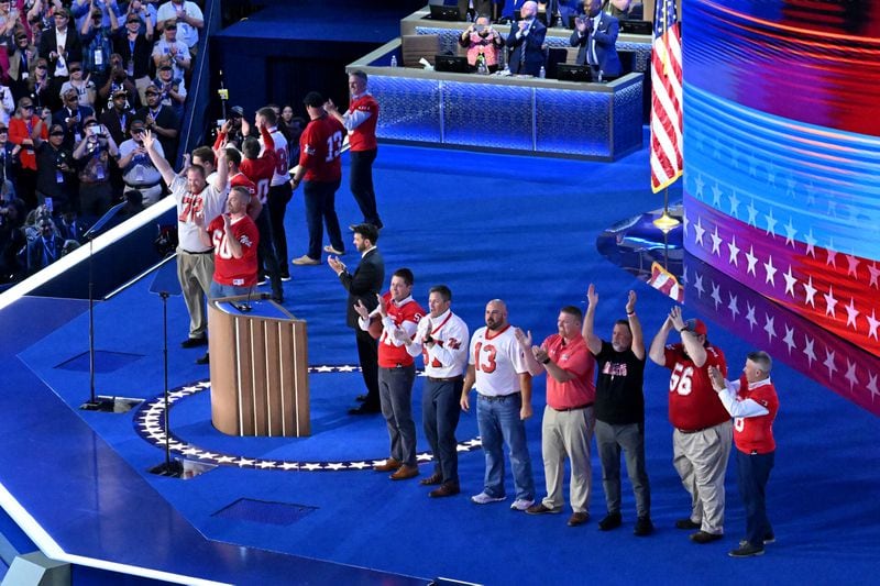 Players on the state championship-winning football team coached by Minnesota Gov. Tim Walz take the stage during the third of the Democratic National Convention at the United Center, Wednesday, August 21, 2024, in Chicago, Illinois. (Hyosub Shin / AJC)