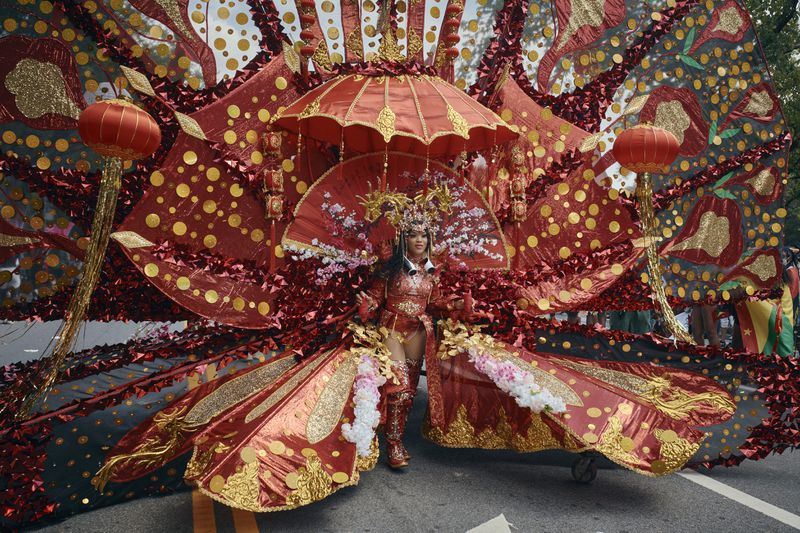 A reveler marches during the West Indian Day Parade on Monday, Sept. 2, 2024, in the Brooklyn borough of New York. (AP Photo/Andres Kudacki)