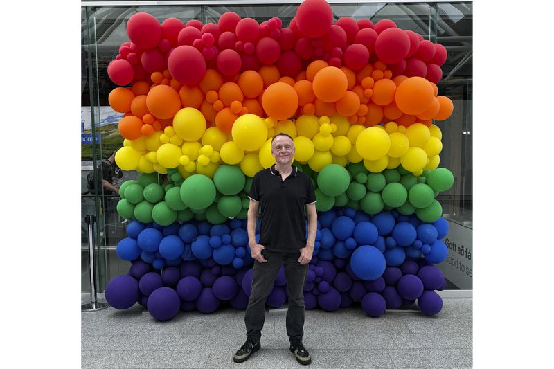 This August 2024 photo shows Mark Chesnut at the Keflavík International Airport in Iceland. Chesnut, a travel blogger and speaker, said LGBTQ+ tourists are concerned about safety in some spots due to the erosion of their human rights in the U.S. and around the world. (Malik Haddington-Ahmed via AP)