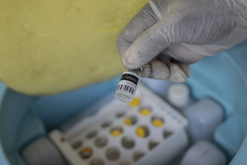 A nurse holds a bottle of mpox vaccine at the General hospital, in Goma, Democratic Republic of Congo Saturday, Oct. 5, 2024. (AP Photo/Moses Sawasawa)