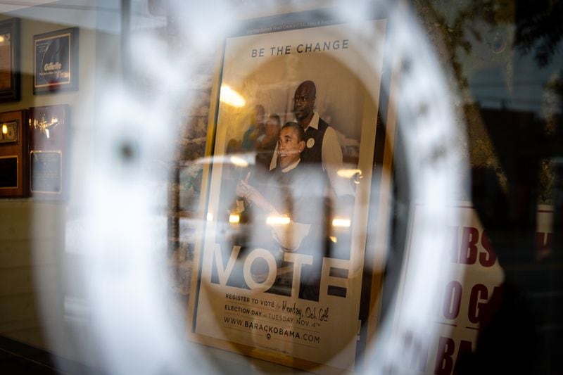 A Barack Obama poster is seen inside Off the Hook Barber Shop in Atlanta on Thursday, May 9, 2024. (Arvin Temkar / AJC)
