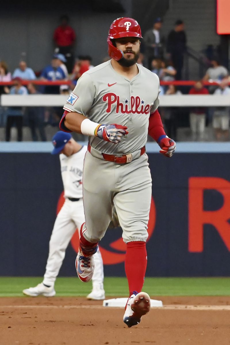 Philadelphia Phillies' Kyle Schwarber (12) runs the bases after hitting a solo home run against the Toronto Blue Jays in the first inning of a baseball game in Toronto, Tuesday Sept. 3, 2024. (Jon Blacker/The Canadian Press via AP)