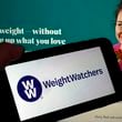 FILE - This image shows the logo of WeightWatchers on a mobile phone, and the company's website, in New York, Tuesday, March 7, 2023. (AP Photo/Richard Drew, File)