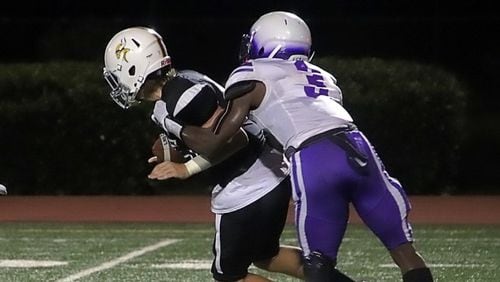 Miller Grove junior linebacker Cayman Spaulding (3), shown making a sack against Lakeside in an early season game, had six tackles for losses and two interceptions (one for a touchdown) in the Wolverines' 34-27 upset of Stephenson on Oct. 8, 2021. (Photo by Mark Brock / DeKalb County Schools)