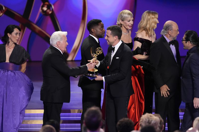 Martin Sheen, far left, Dule Hill, Allison Janney, Janel Moloney, and Richard Schiff present the award for outstanding drama series to Justin Marks, center, and Hiroyuki Sanda for "Shogun" during the 76th Primetime Emmy Awards on Sunday, Sept. 15, 2024, at the Peacock Theater in Los Angeles. (AP Photo/Chris Pizzello)