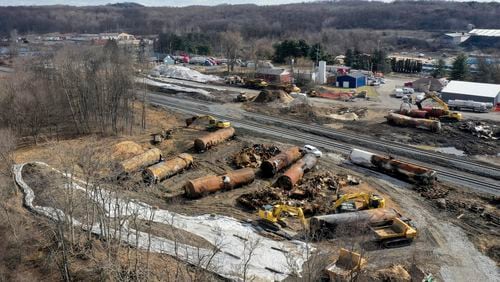 FILE - A view of the scene Feb. 24, 2023, as cleanup continues at the site of a Norfolk Southern freight train derailment that happened on Feb. 3, in East Palestine, Ohio. The goal of a new federal rule finalized Monday, June 24, 2024 is ensuring first responders can find out what hazardous chemicals are on a train almost immediately after a derailment, so they can respond appropriately. (AP Photo/Matt Freed, File)