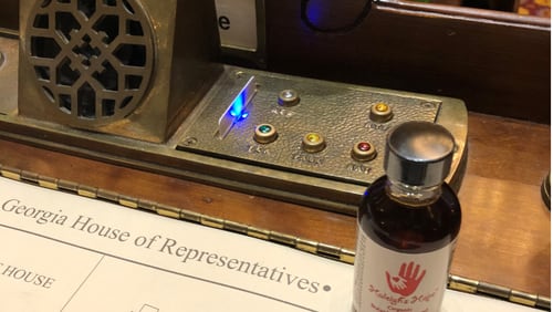 A vial of cannabis oil on the desk of a state lawmaker, circa 2018.