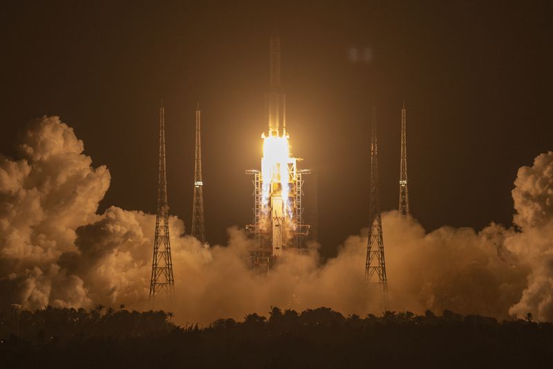 FILE - In this Nov. 24, 2020, file photo, a Long March-5 rocket carrying the Chang'e 5 lunar mission lifts off at the Wenchang Space Launch Center in Wenchang in southern China's Hainan Province. (AP Photo/Mark Schiefelbein, File)