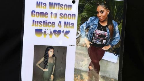 Images of Nia Wilson, who was fatally stabbed at a BART Station, are worn by a family member Wednesday, July 25, 2018, outside a courtroom in Oakland, Calif.