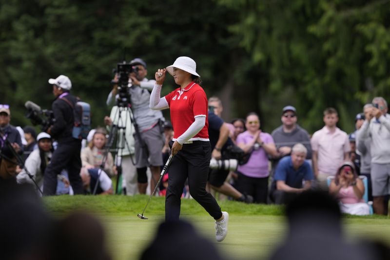 Amy Yang, of South Korea, reacts after finishing the eighth hole during the final round of the Women's PGA Championship golf tournament at Sahalee Country Club, Sunday, June 23, 2024, in Sammamish, Wash. (AP Photo/Lindsey Wasson)