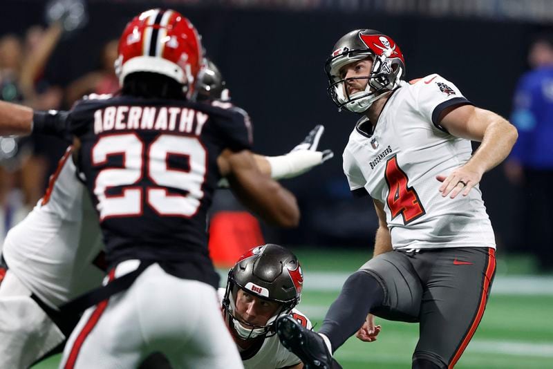 Tampa Bay Buccaneers place kicker Chase McLaughlin (4) watches his field goal against the Atlanta Falcons during the second half of an NFL football game Thursday, Oct. 3, 2024, in Atlanta. (AP Photo/Butch Dill)