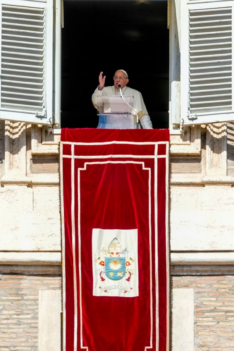 Pope Francis appears at the window of his studio for the traditional noon blessing of faithful and pilgrims gathered in St. Peter's Square at The Vatican, Thursday, Dec. 7, 2006. (AP Photo/Andrew Medichini)