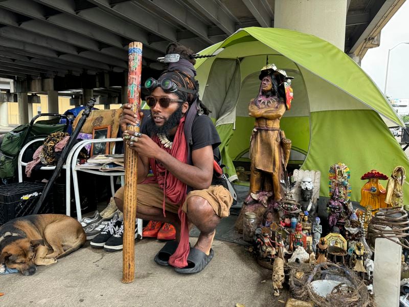 Ronell King, 32, unhoused, plans to hunker down in his tent under an overpass Tuesday, Sept. 10, 2024, in New Orleans, rather than go to an emergency shelter set up by the city. (AP/Jack Brook)