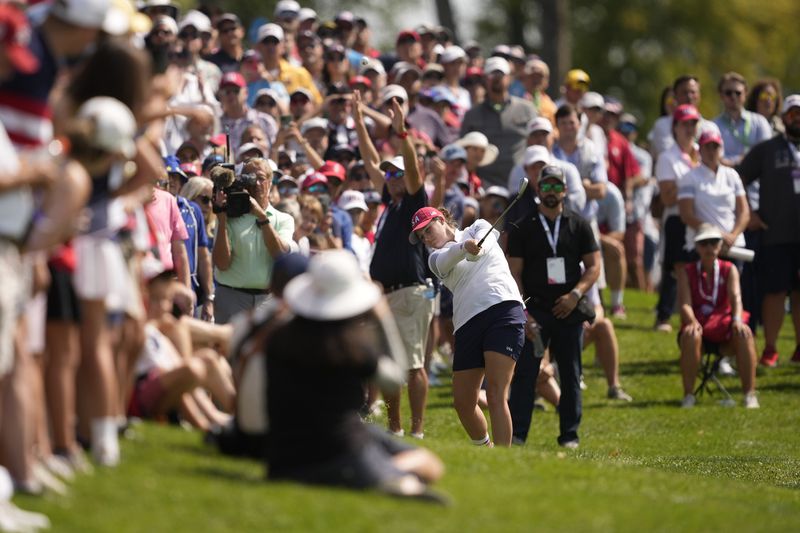 United States' Ally Ewing hits from the 18th fairway during a Solheim Cup golf tournament foursome match at Robert Trent Jones Golf Club, Saturday, Sept. 14, 2024, in Gainesville, Va. (AP Photo/Matt York)