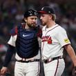 Atlanta Braves pitcher Spencer Schwellenbach, right, greets Atlanta Braves catcher Travis d'Arnaud after the end of the top of the seventh inning against the New York Mets at Truist Park, Tuesday, Sept. 24, 2024, in Atlanta. The Braves won 5-1. (Jason Getz / AJC)

