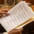 A member of the Georgia electoral college looks over a Certificate of Vote during the official casting of the ballot on Dec. 14 2020, in the Georgia Senate Chambers at the Georgia State Capitol in Atlanta. (Alyssa Pointer/The Atlanta Journal-Constitution)