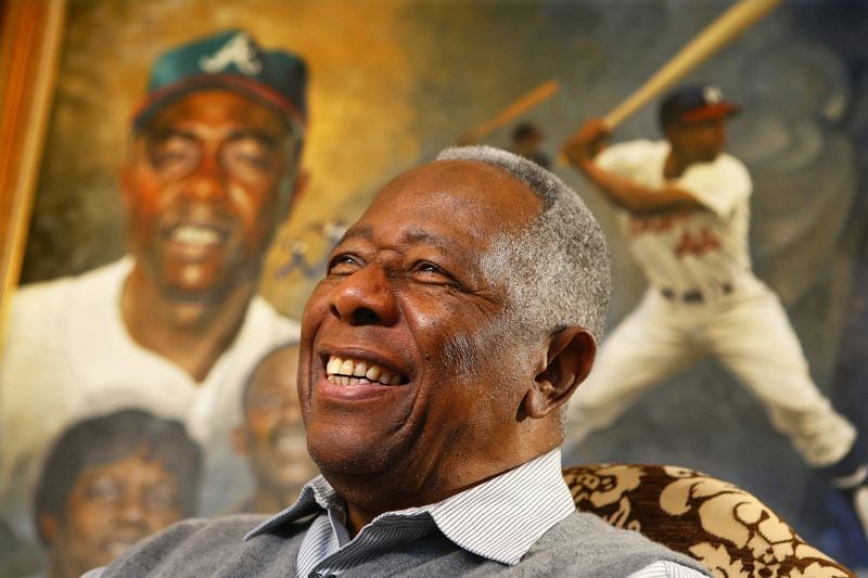 The late Braves legend Hank Aaron breaks into a smile on the eve of his 80th birthday in 2014.