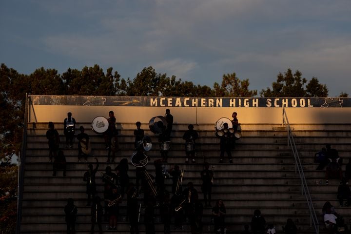 Fans are seen under the McEachern High School sign during a GHSA High School football game between Langston Hughes High School and McEachern High School at McEachern High School in Powder Springs, GA., on Friday, August 26, 2022. (Photo by Jenn Finch)