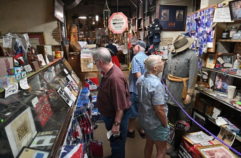 June 16, 2022 Kennesaw - Customers shop at Wildman's Civil War Surplus in Kennesaw on Thursday, June 16, 2022. The store first opened in downtown Kennesaw in 1971. When the owner, Dent Myers died in January, Marjorie Lyon vowed to keep the shop open. Councilman James “Doc” Eaton resigned from Kennesaw City Council Tuesday over the reopening of Wildman’s Civil War shop. (Hyosub Shin / Hyosub.Shin@ajc.com)
