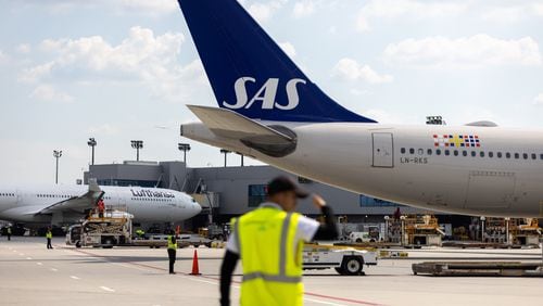 A Scandinavian Airlines plane from Copenhagen arrives at Hartsfield-Jackson airport in Atlanta on Monday, June 17, 2024. The airport and airline hosted an inaugural flight event for a new route of daily nonstop flights between Atlanta and Copenhagen. (Arvin Temkar / AJC)