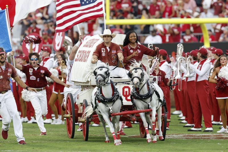 The Oklahoma Sooner Schooner runs out onto the field ahead of the team before an NCAA college football game against Temple, Friday, Aug. 30, 2024, in Norman, Okla. (AP Photo/Alonzo Adams)