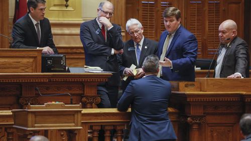 March 16, 2020 - Atlanta - Senate members and staff confer before the vote.  Georgia lawmakers gathered in an extraordinary special session on Monday and voted to grant Gov. Brian Kemp sweeping new powers to respond to the coronavirus pandemic. It's the first time in state history a governor has declared a public health emergency, and Kemp cast it as essential to deploy all available resources to contain a disease that's sickened dozens of Georgians and has killed one.    Bob Andres / robert.andres@ajc.com