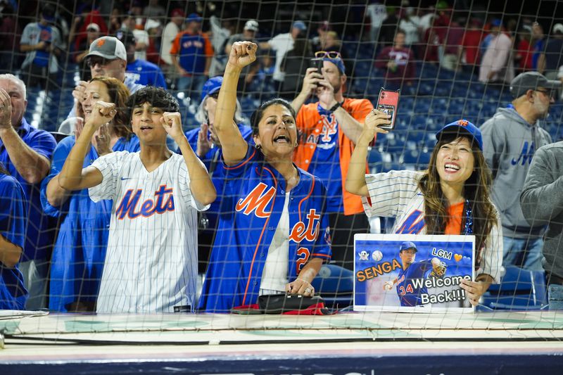 New York Mets fans celebrate after the Mets won Game 1 of a baseball NL Division Series against the Philadelphia Phillies, Saturday, Oct. 5, 2024, in Philadelphia. (AP Photo/Chris Szagola)